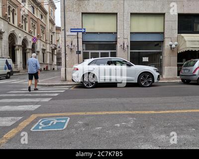 white audi q8 parked in the streets Stock Photo