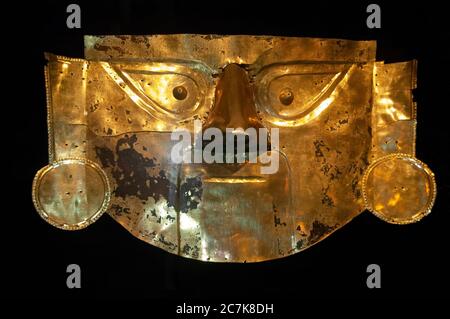 Lambayeque, Peru - October 31, 2008: Golden funeral mask of the Peruvian Lords of Sipan, Chimu culture. Stock Photo