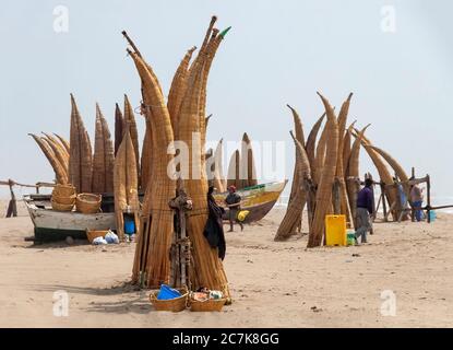 Pimentel beach, Chiclayo, Peru - October 31, 2008: Traditional Peruvian small Reed Boats (Caballitos de Totora), straw boats still used by local fishe Stock Photo