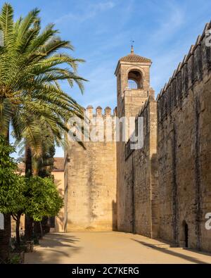 The 14th century crenelated wall and Tower of Homage (or Clock Tower) of the historic Alcázar de los Reyes Cristianos in Córdoba Stock Photo