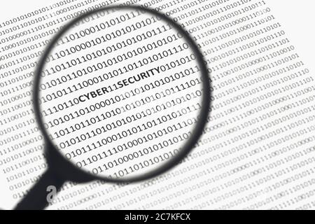 Selective focus shot through a magnifier of a white surface with cyber security, on it Stock Photo