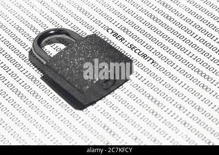 Selective focus shot of a white surface with ones and zeros and a lock over it Stock Photo
