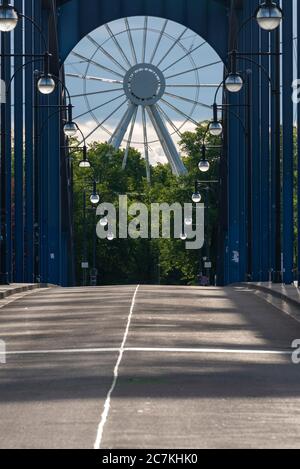 Germany, Saxony-Anhalt, Magdeburg: View over the Sternbrücke onto a 55-meter ferris wheel. It was built in the middle of a corona crisis. It is still unclear when it can be operated. Stock Photo