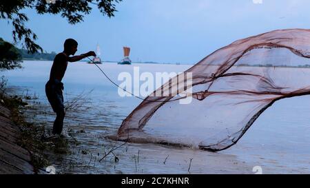 Padma of fishermen using coop-like trap catching fish in river,faridpur sadar,Bangladesh Stock Photo