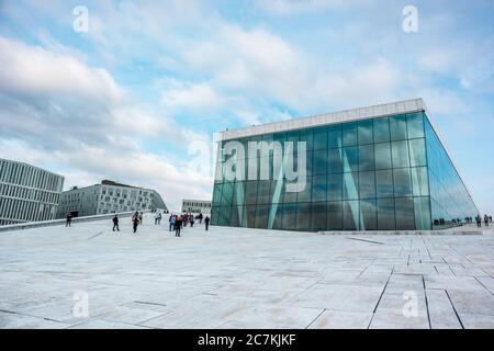 Oslo, Norway - September 10, 2019: Oslo Opera House exterior. Modern architecture exterior of the building with white granite and scenic clouds. Stock Photo