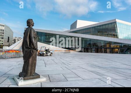 Oslo, Norway - September 10, 2019: Kirsten Flagstad statue in front of Oslo Opera House. Modern architecture exterior of the building with white grani Stock Photo