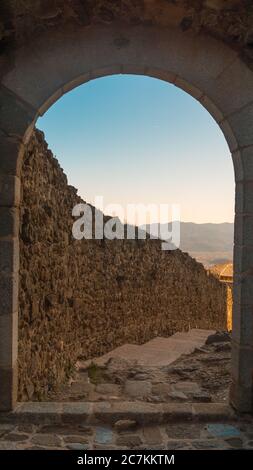 Beautiful shot of an arch design with a stairway in a rocky wall Stock Photo