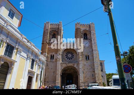 Horizontal shot of Lisbon Cathedral during a hot bright sunny cloudless day Stock Photo