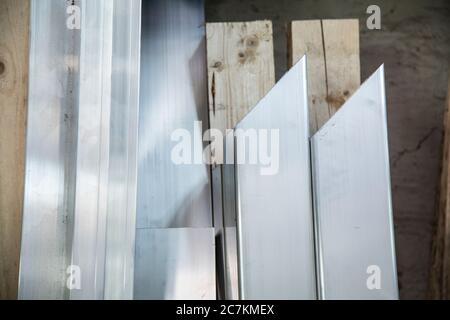 High angle view of square tubes on wooden planks under the lights Stock Photo