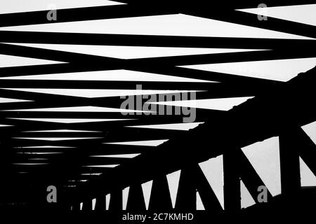 Abstract shot of a bridge's railings with interesting shapes and lines Stock Photo