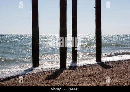West Pier detached pillars silhouetted against the ocean Stock Photo