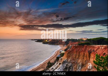 Europe, Portugal, Algarve, Litoral, Barlavento, District Faro, between Vilamoura and Albufeira, Olhos de Agua, sunset on the cliff Stock Photo