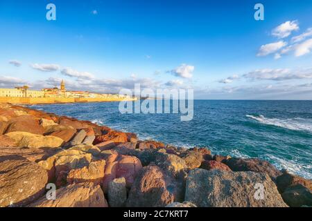 Marvelous evening cityscape of historical part of Alghero town. Fantastic  Mediterranean seascape. Location:  Alghero, Province of Sassari, Italy, Eur Stock Photo