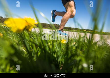 Young man jogging in nature Stock Photo