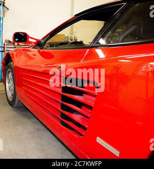 The side air intakes are typical of this sports car of the brand with the jumping horse. Stock Photo