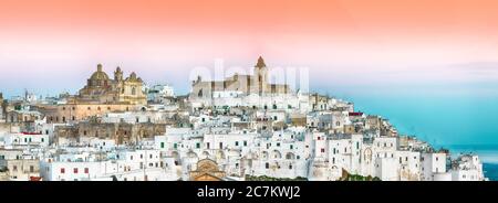 Ostuni white town skyline at sunrise. Brindisi, Apulia southern Italy. Europe. Stock Photo