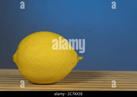 Citrus fruits- lemon, on the wooden , On a blue background Stock Photo