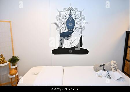 Massage room interior. Massage couch with accessories for massages and rehabilitation. Stock Photo