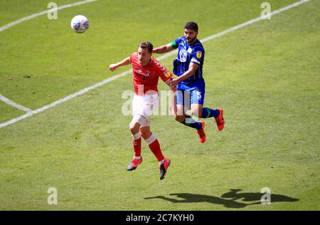 Charlton Athletic's Tom Lockyer (left) and Wigan Athletic's Sam Morsy battle for the ball in the air during the Sky Bet Championship match at The Valley, London. Stock Photo