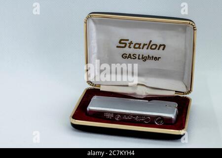 Retro refillable lighter in its case from the 70s Stock Photo