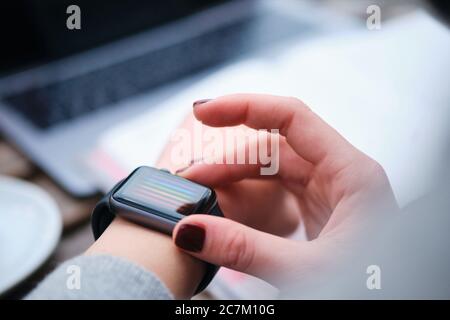 Close up woman hands using smartwatch Stock Photo