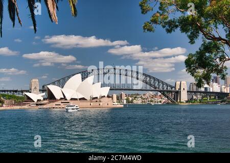 Classic view of the Opera House and Sydney Harbour Bridge viewed across Farm Cove from Mrs Macquarie's Point, Sydney, New South Wales, Australia. Stock Photo