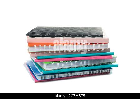 Pile of different notebooks isolated on white background Stock Photo