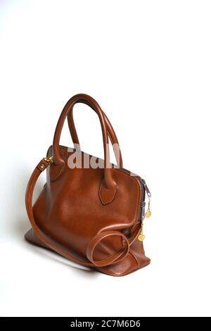 Closeup studio shot of a brown leather handbag on white background Stock Photo