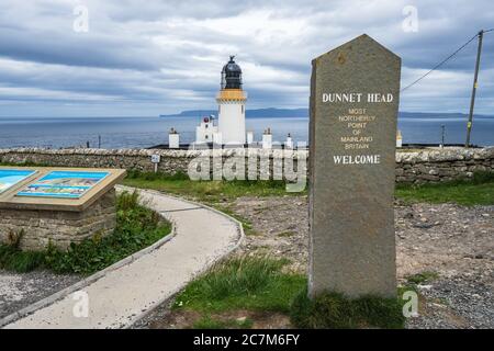Dunnet Head lighthouse and welcome marker in Dunnet Head, Pentland Firth, Scotland Stock Photo