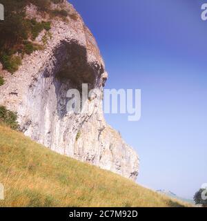 This is geological-geographical overhanging limestone wonder of Kilnsey Crag near the Yorkshire Dales village of Kettlewell in the spring of 1980 Stock Photo