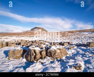 This is Pen-y-Ghent mountain, at the head of the Ribblesdale valley and village of Horton in Ribblesdale one of the famous Yorkshire Dales Three Peaks of Penyghent, Ingleborough and Whernside during the winter of 1980 Stock Photo