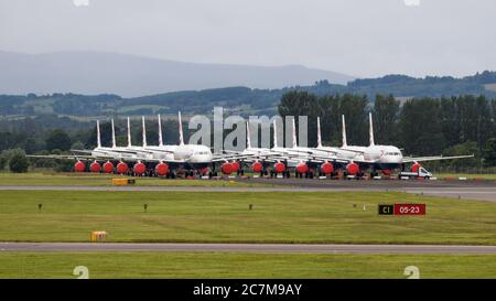 Glasgow, Scotland, UK. 17 July 2020. Pictured:  Grounded British Airways Airbus A319/A320/A321 aircraft form the backdrop showing how bad the coronavirus (COVID19) crisis has affected the global airline industry.  British Airways today axed all of its Boeing 747 services cutting back and have already axed a quarter of its staff due to the pandemic. Credit: Colin Fisher/Alamy Live News. Stock Photo