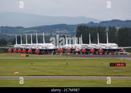 Glasgow, Scotland, UK. 17 July 2020. Pictured:  Grounded British Airways Airbus A319/A320/A321 aircraft form the backdrop showing how bad the coronavirus (COVID19) crisis has affected the global airline industry.  British Airways today axed all of its Boeing 747 services cutting back and have already axed a quarter of its staff due to the pandemic. Credit: Colin Fisher/Alamy Live News. Stock Photo