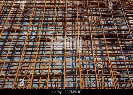 Rusty reinforcement steel mesh mats prepared for a base plate on a construction site Stock Photo
