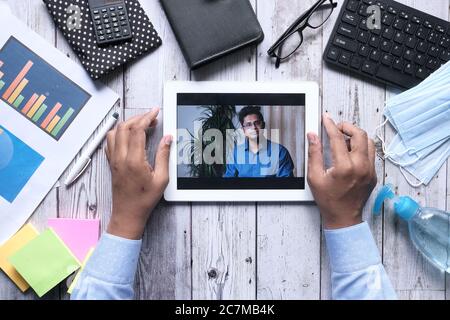 high angle view of two people working in video conference Stock Photo