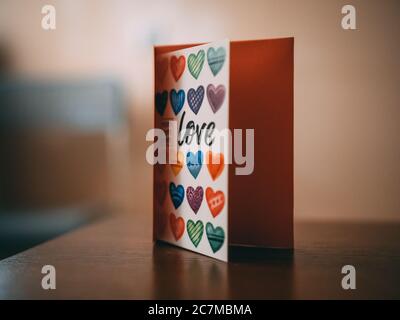 Colorful copybook with hearts and love written on it Stock Photo