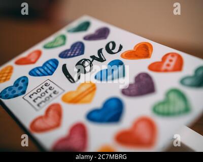 Colorful copybook with hearts and love written on it Stock Photo