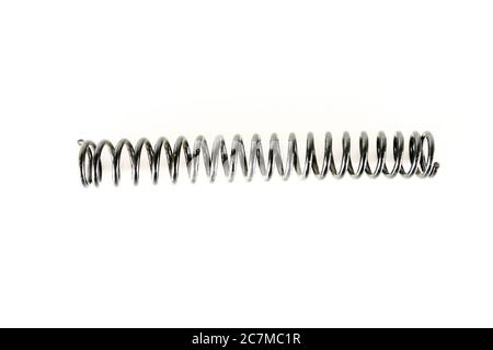 Gray metal spring on a white background Stock Photo