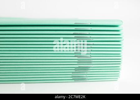 stack of thin student notebooks for elementary school Stock Photo