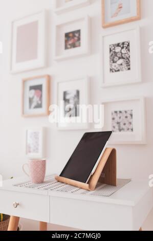 Vertical closeup shot of a tablet set on a bedside table Stock Photo