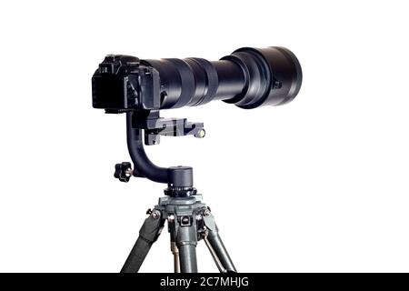 Horizontal shot of a Gimbal Tripod Head holding a digital camera with a long telephoto zoom lens on a white background. Stock Photo