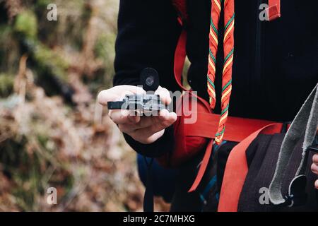 Closeup shot of a gadget remote control in a human hand Stock Photo