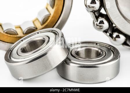 Macro shot of two ball bearings, isolated on a white background, selective focus. Stock Photo