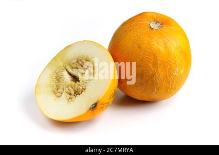 Whole and sliced ripe yellow melon fruit isolated on white background. Stock Photo
