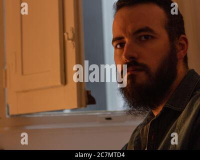 Bearded attractive male looking at the camera Stock Photo