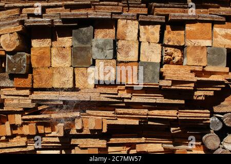 A pile of processed wood intended to serve as firewood / burning material Stock Photo