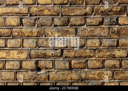 Wall made out of brown rectangular stones Stock Photo