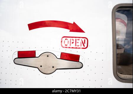 Exterior handle on the main passenger door of a white Boeing 777 aircraft Stock Photo