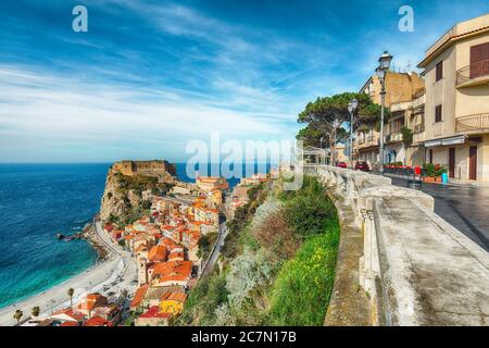 Beautiful seaside town village Scilla with old medieval castle on rock Castello Ruffo, colorful traditional typical italian houses on Mediterranean Ty Stock Photo