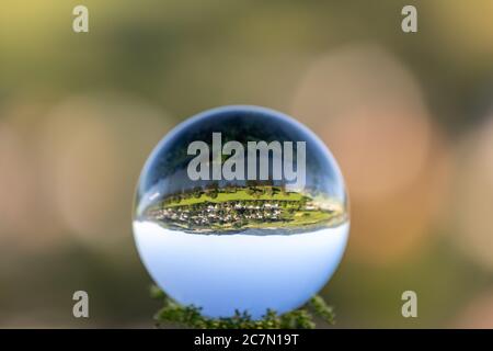 Crystal ball with lriver Moselle valley and defocused background Stock Photo
